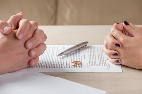 Divorce agreement hands folded